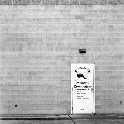 Multi Media Musketeers door on empty wall