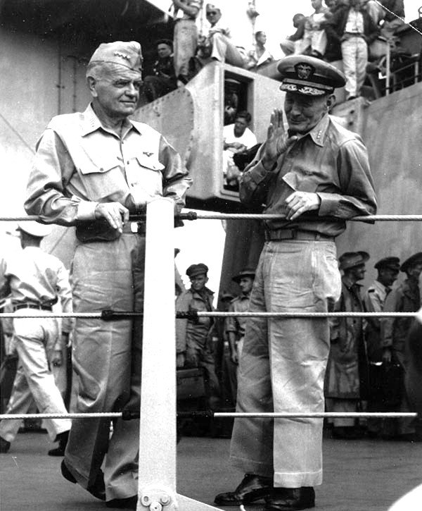 Admirals Halsey and McCain talk after the surrender ceremony, with Campbell visible in the rangefinder window above